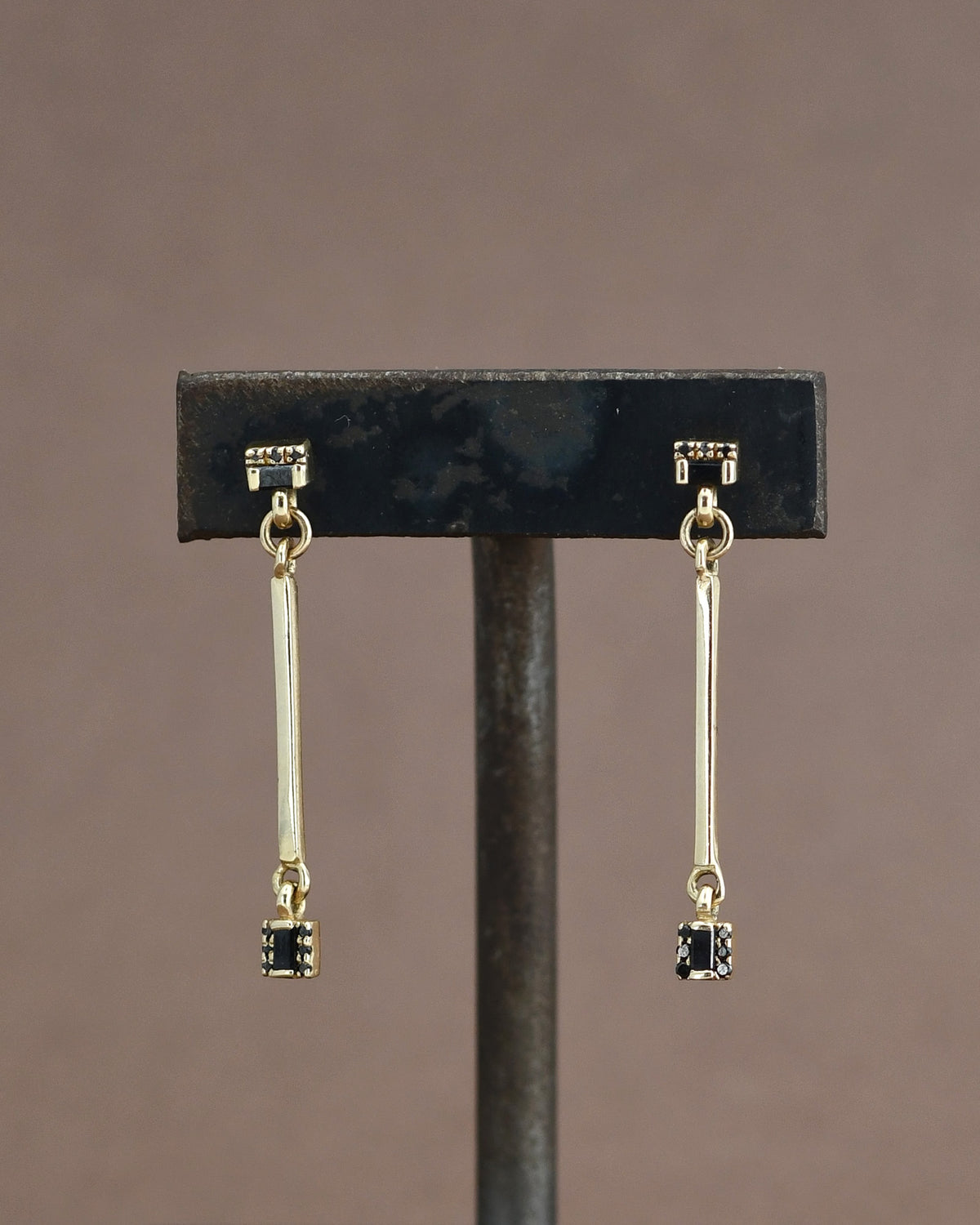 Gold earrings with black diamonds