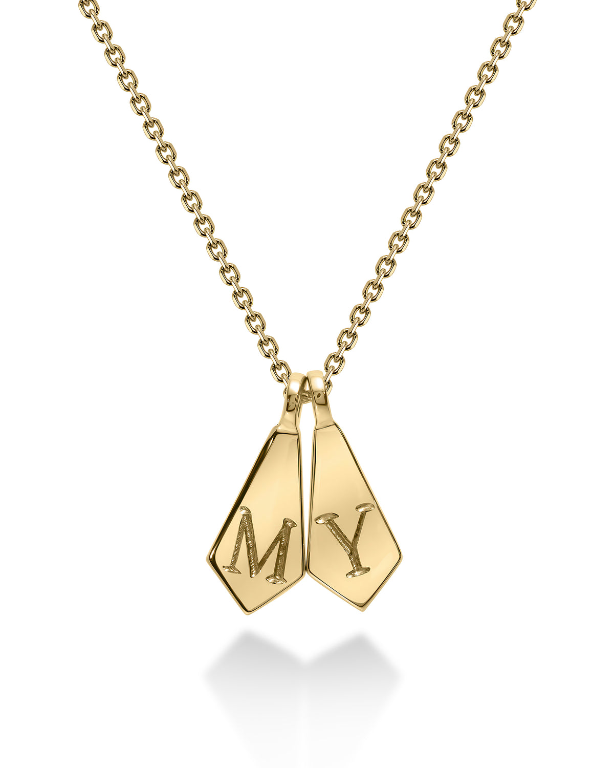A gold initial necklace featuring two diamond-cut pendant tags engraved with the letters 'M' and 'Y', suspended from a delicate gold chain on a white background.