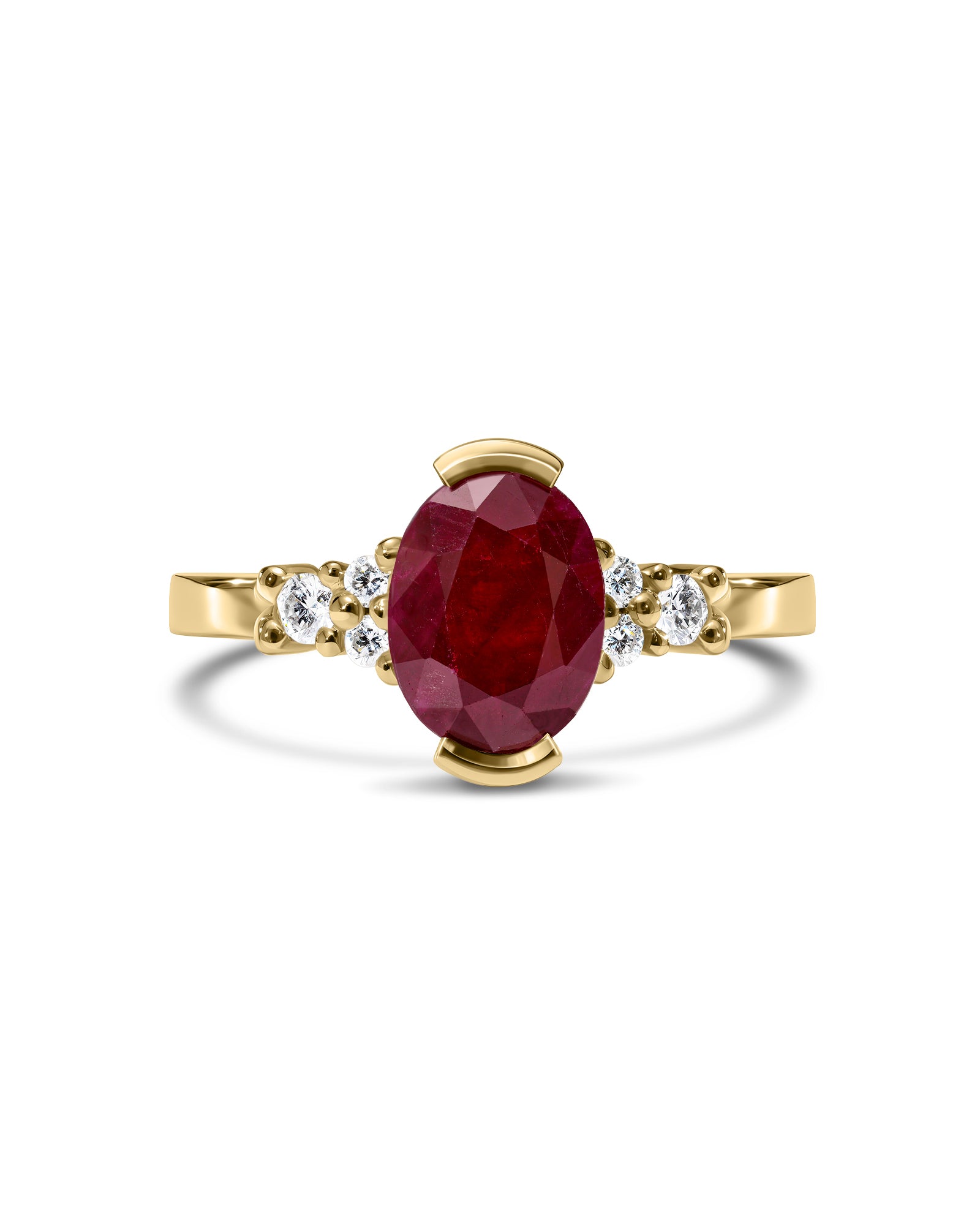 Gold ring with a ruby gemstone and smaller diamonds on a white background
