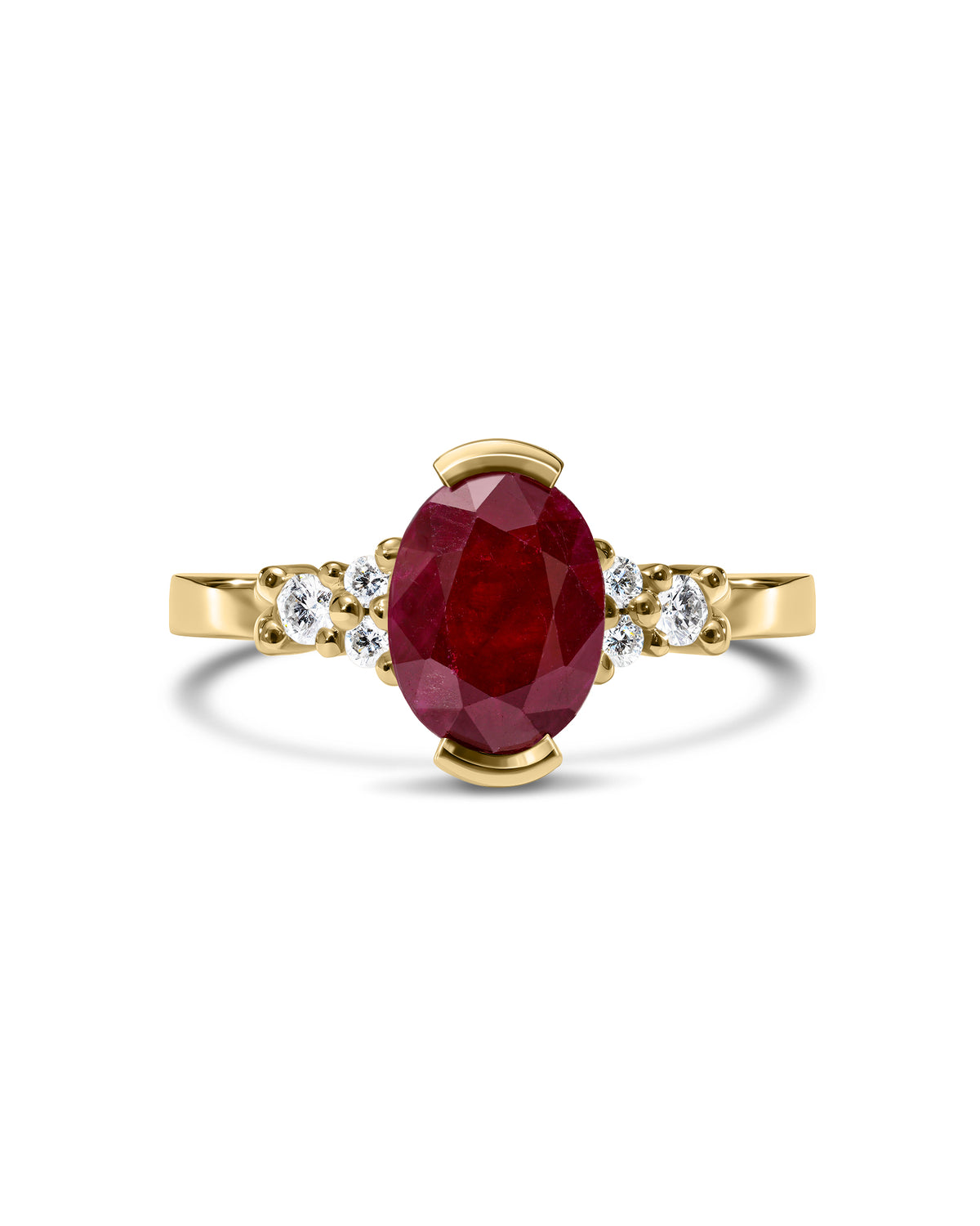 Gold ring with a ruby gemstone and smaller diamonds on a white background