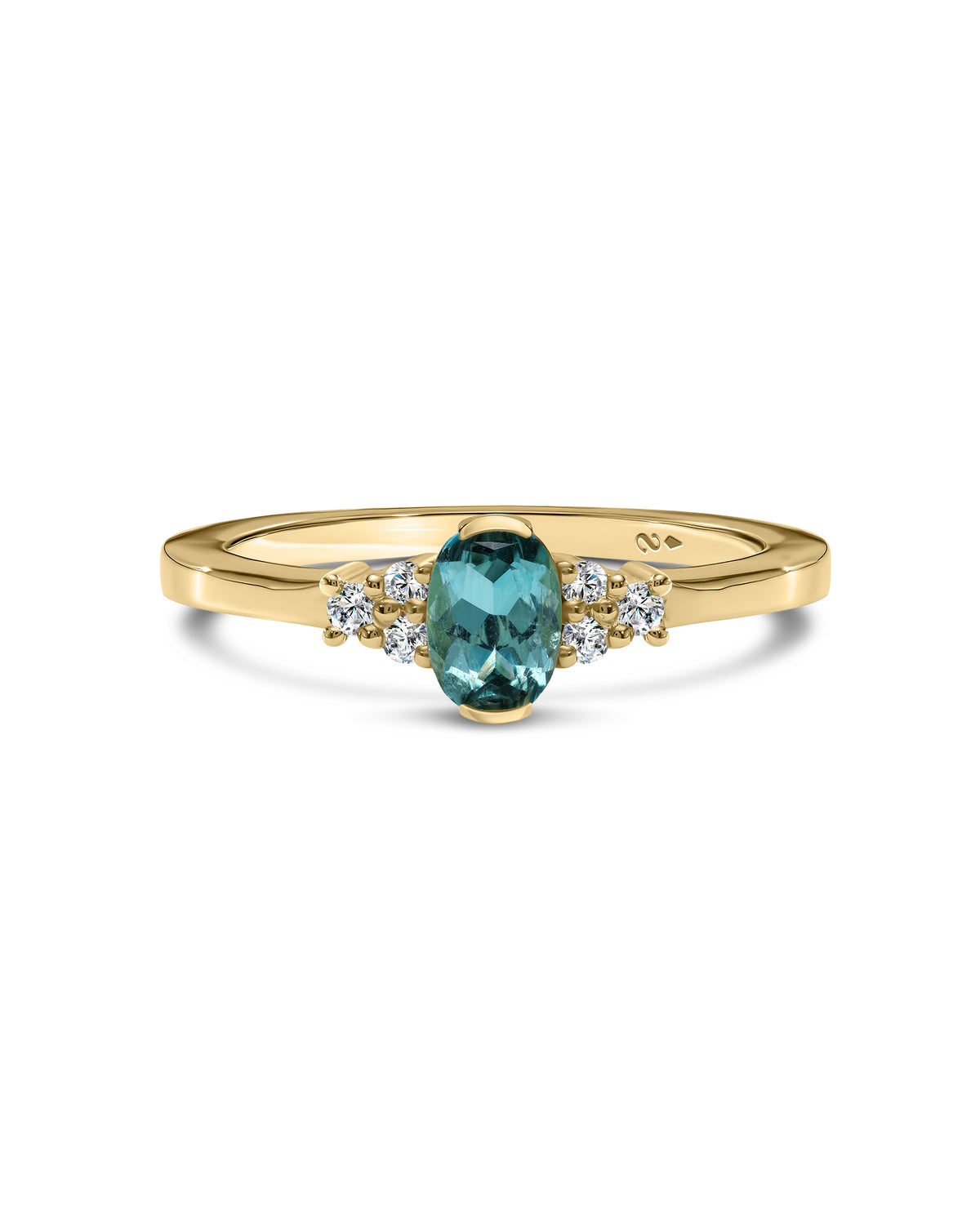 A yellow gold ring featuring a central oval-cut blue gemstone accented by small round clear stones on either side, set against a plain white background.