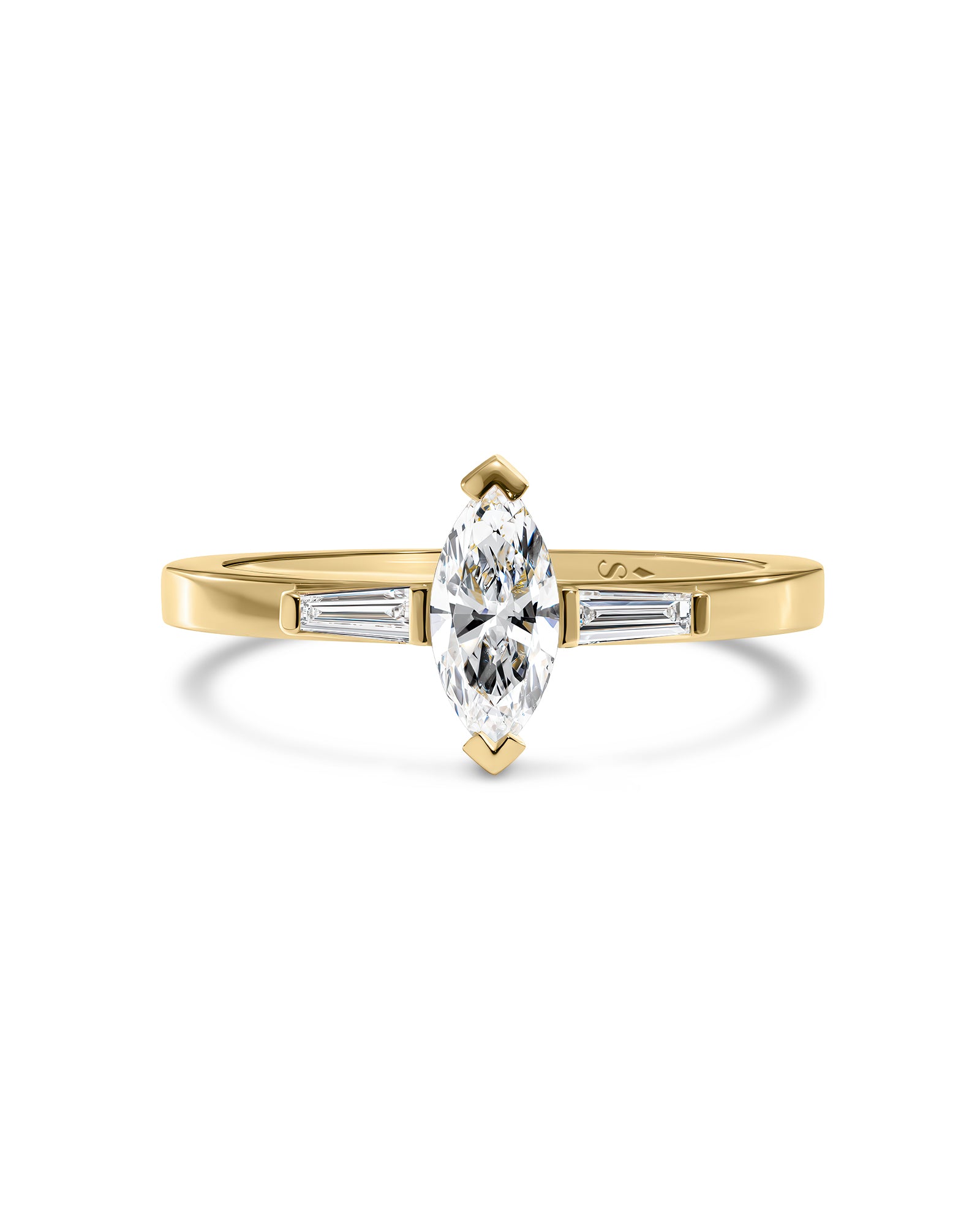 A yellow gold ring featuring a marquise-cut clear center white diamond with tipper-cut side diamonds, shown on a clean white background.
