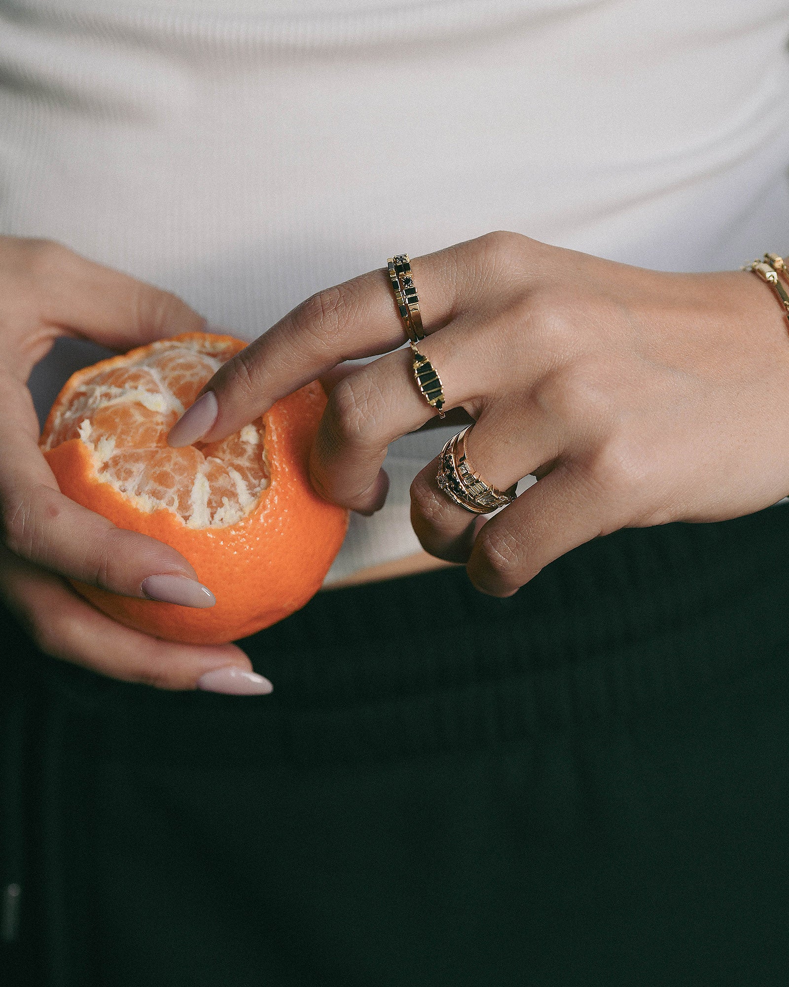 hand with black diamonds gold rings