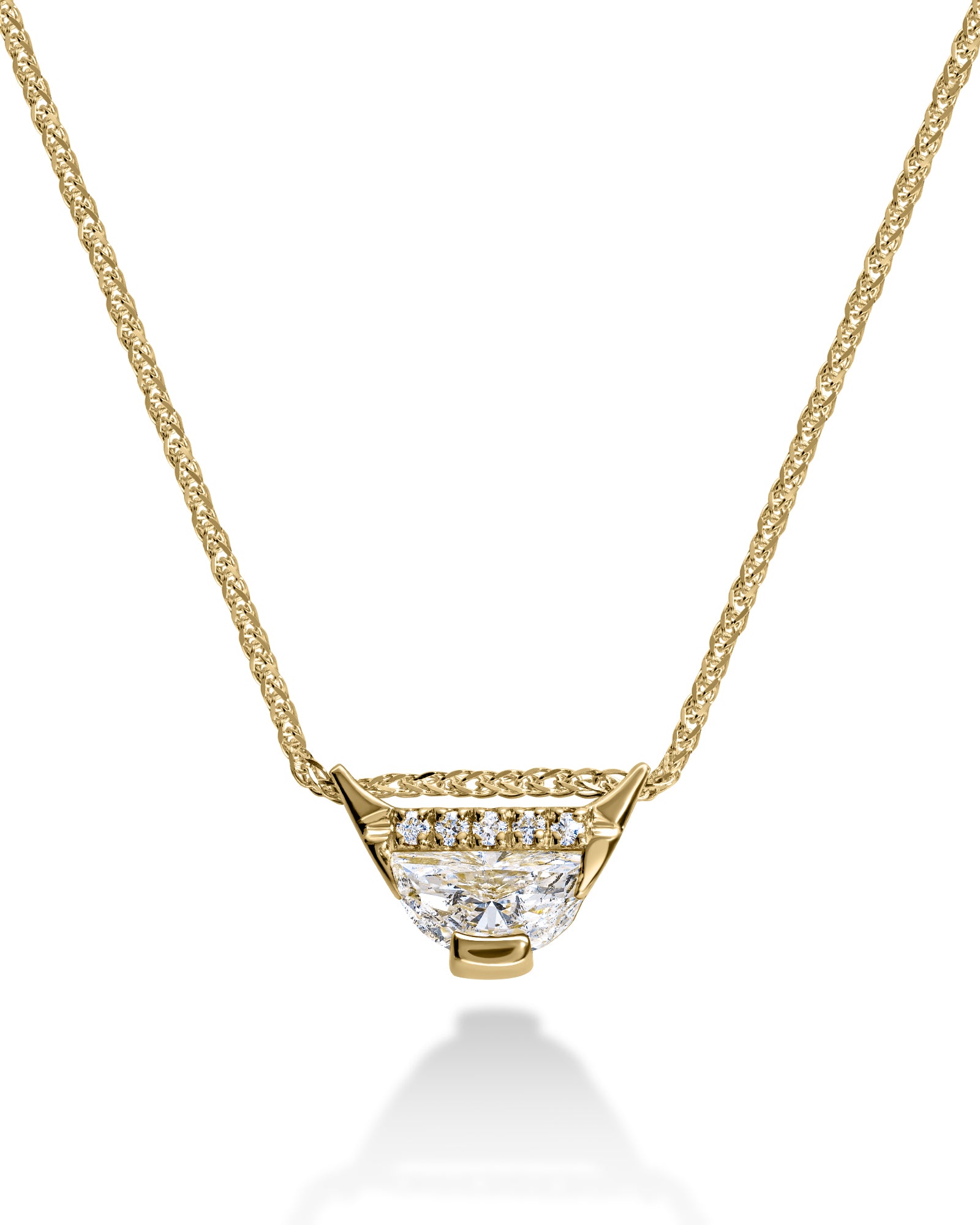 Gold necklace with a diamond pendant on a white background
