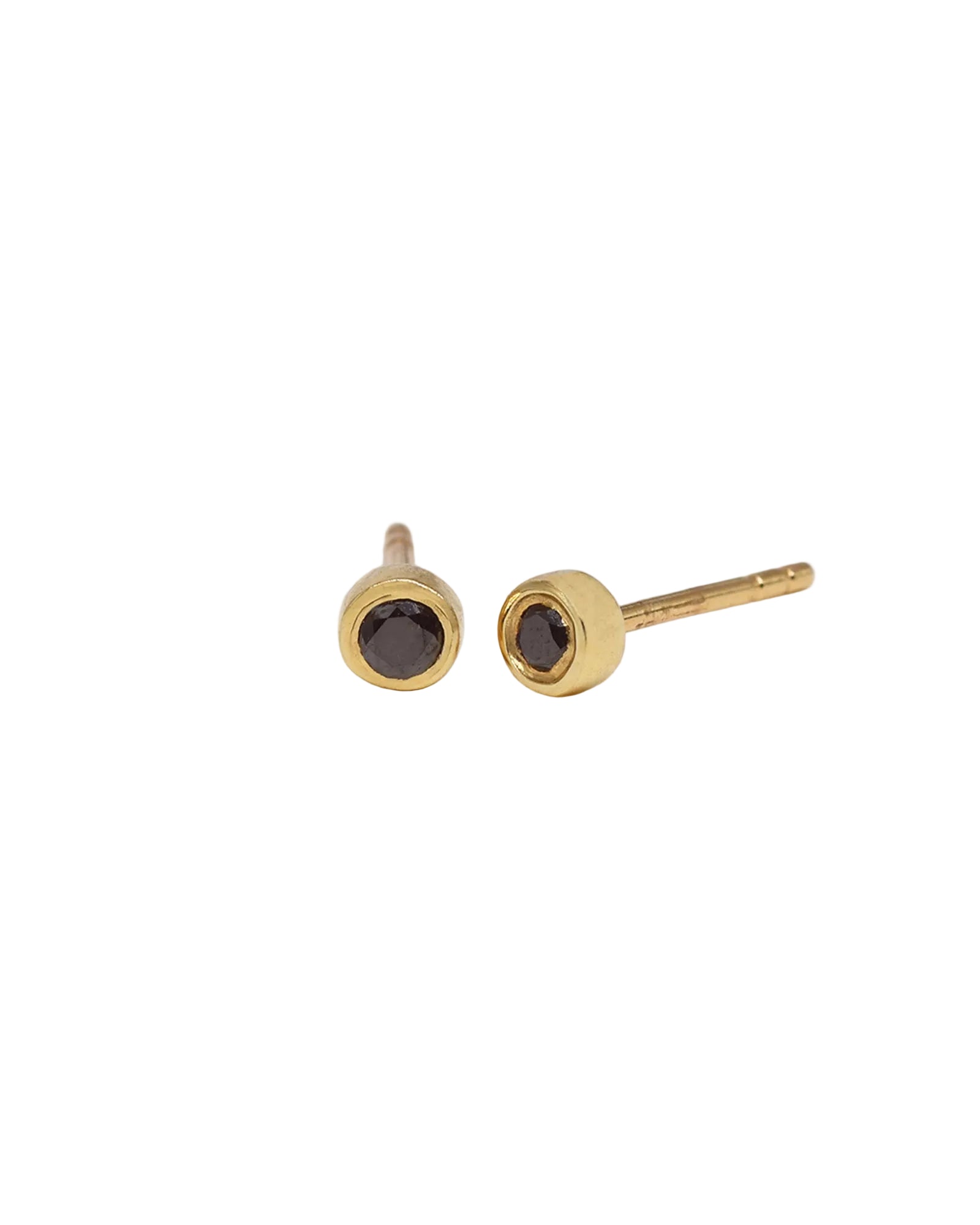 A pair of gold stud earrings with round dark smoky black diamonds, shown on a plain white background.