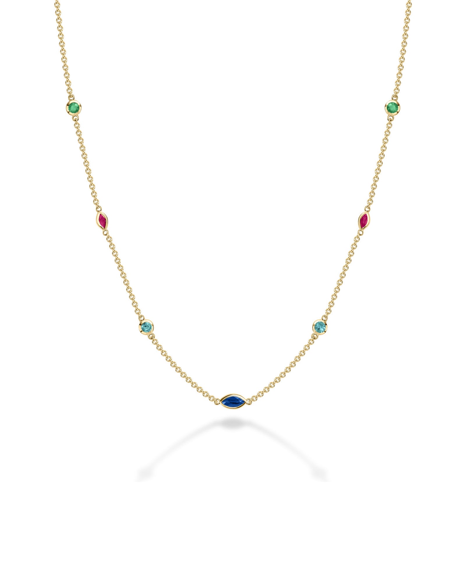 A delicate gold chain necklace featuring multiple small, colorful gemstone settings along the chain, including green round -cut emerald, red ruby marquise-cut stones, blue round -cut tourmaline, and d blue sapphire marquise-cut stones, displayed on a clean white background with a soft reflection.
