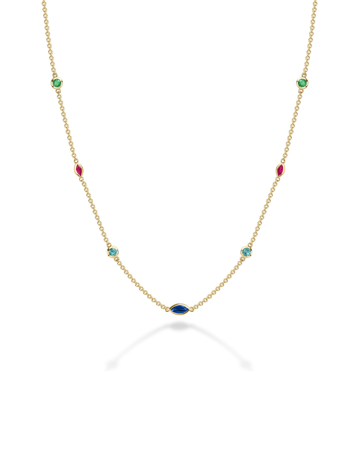 A delicate gold chain necklace featuring multiple small, colorful gemstone settings along the chain, including green round -cut emerald, red ruby marquise-cut stones, blue round -cut tourmaline, and d blue sapphire marquise-cut stones, displayed on a clean white background with a soft reflection.