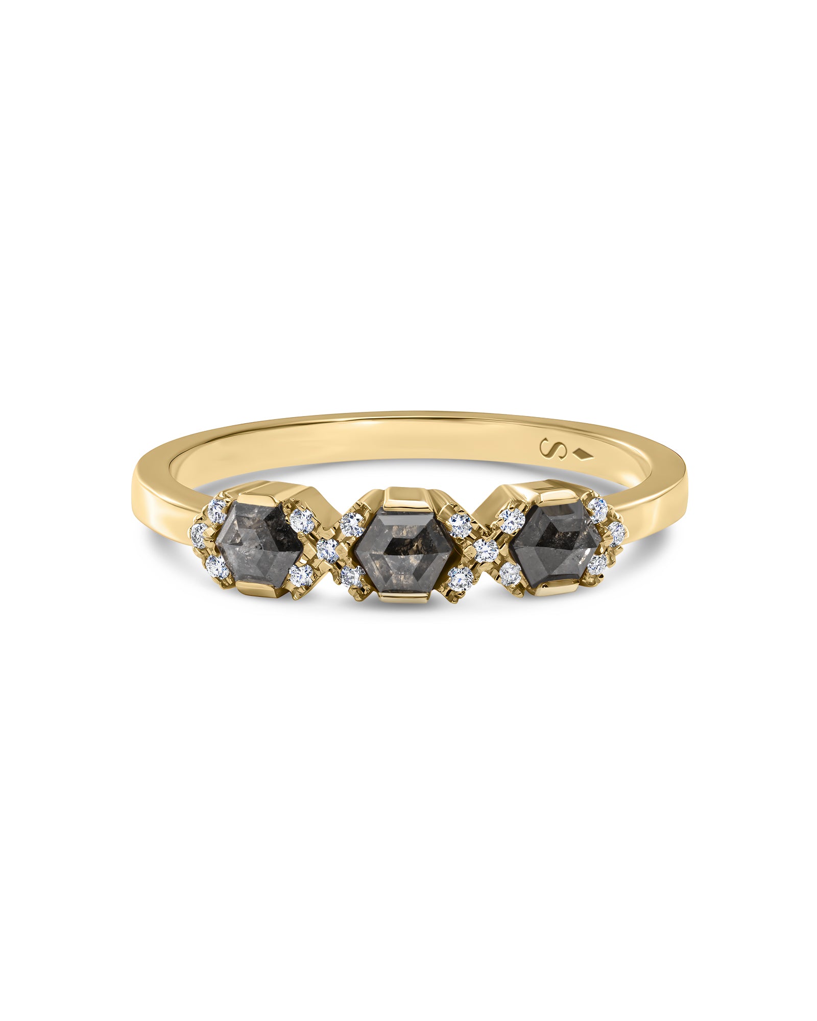 A yellow gold ring featuring three hexagonal dark gray diamonds in a row, each accented with small clear diamonds, shown on a plain white background.