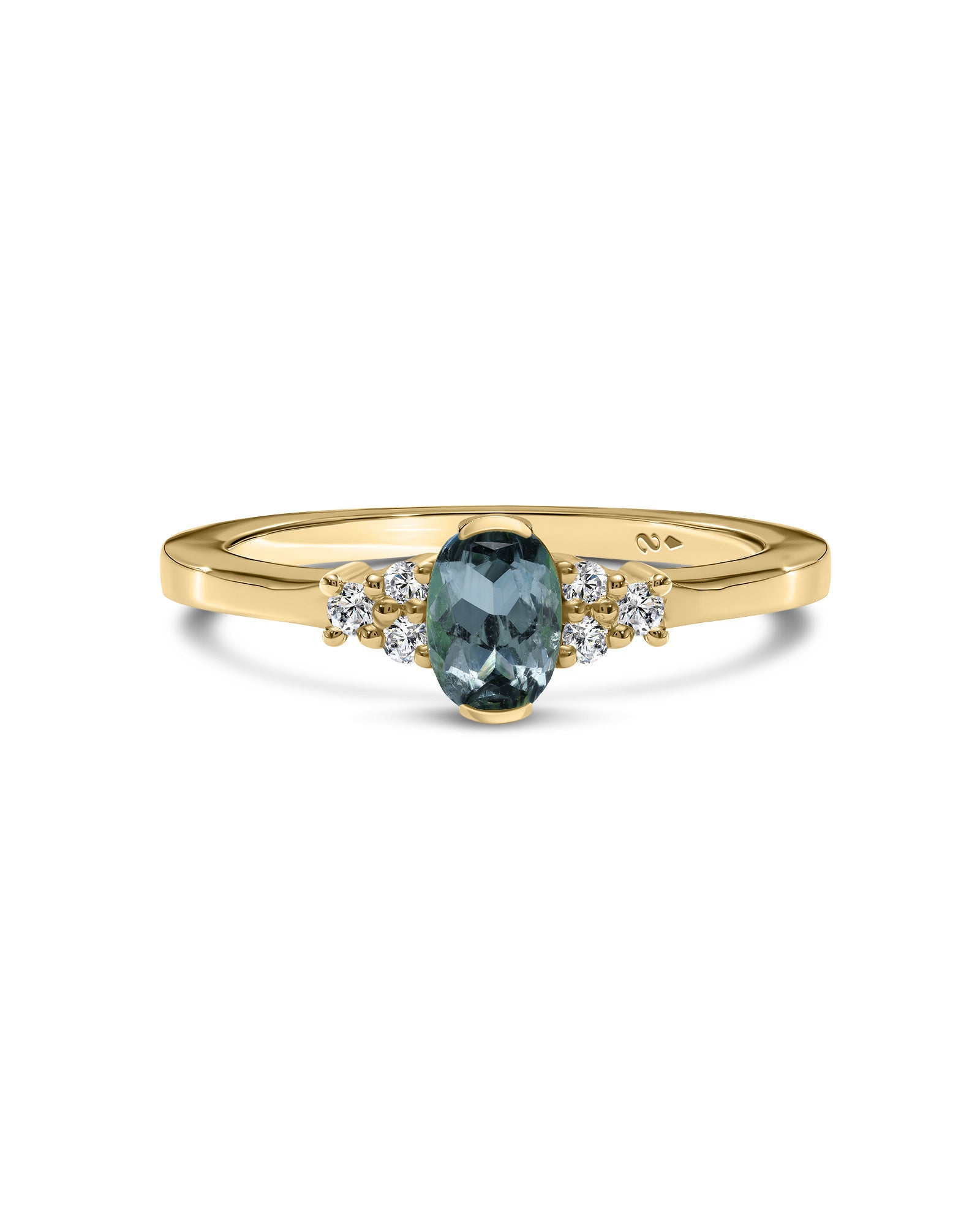 A yellow gold ring featuring a central oval-cut green sepphire gemstone accented by small round clear diamonds on either side, set against a plain white background.