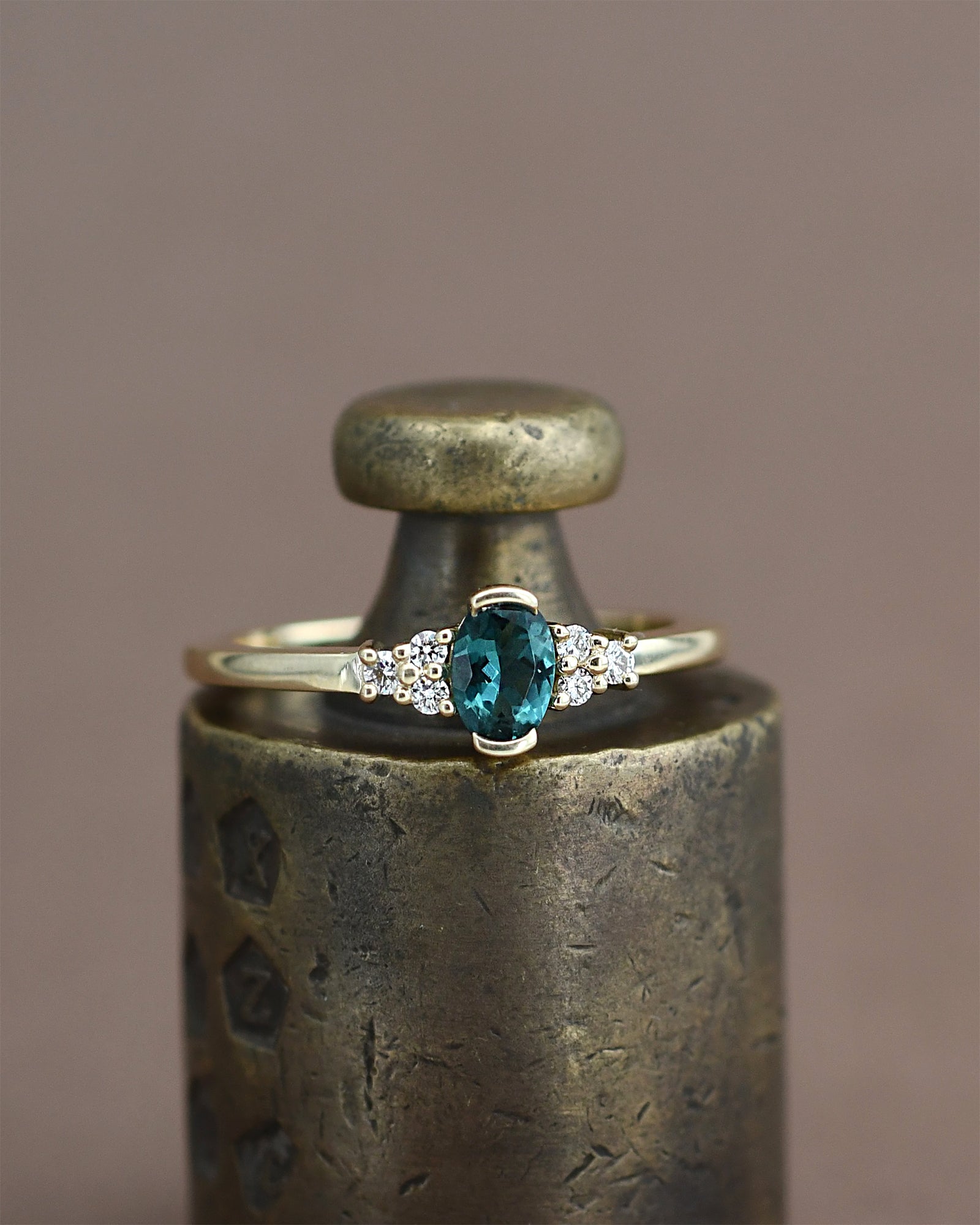 gold ring with a blue gemstone 