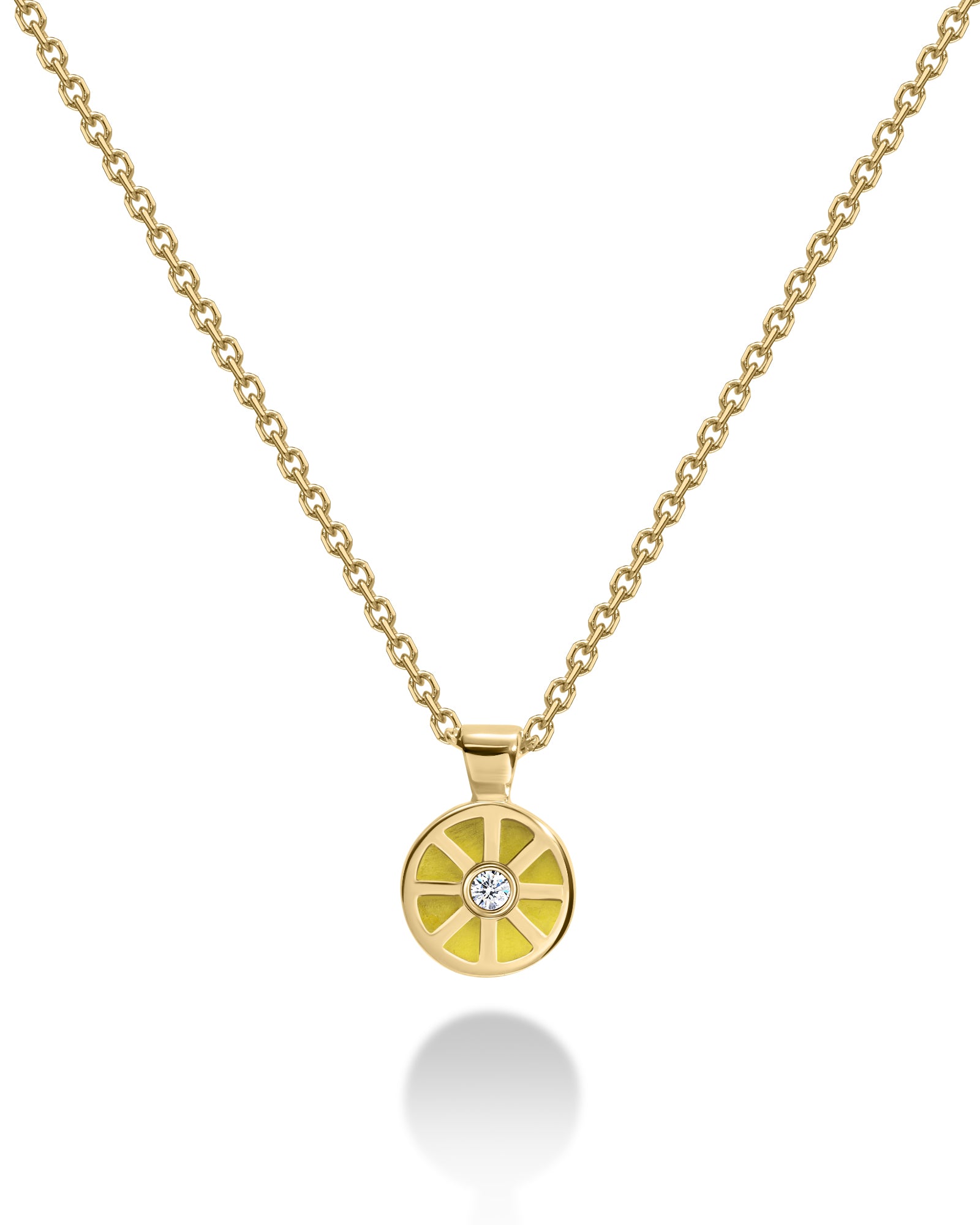 Gold necklace with a round yellow pendant featuring a diamond 