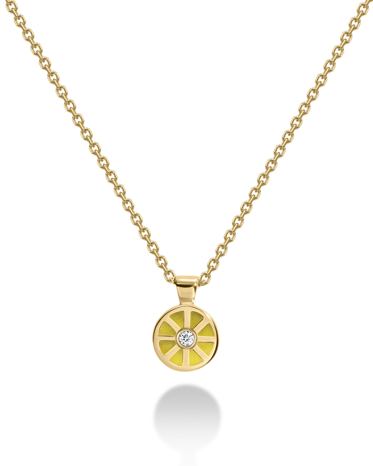 Gold necklace with a round yellow pendant featuring a diamond 