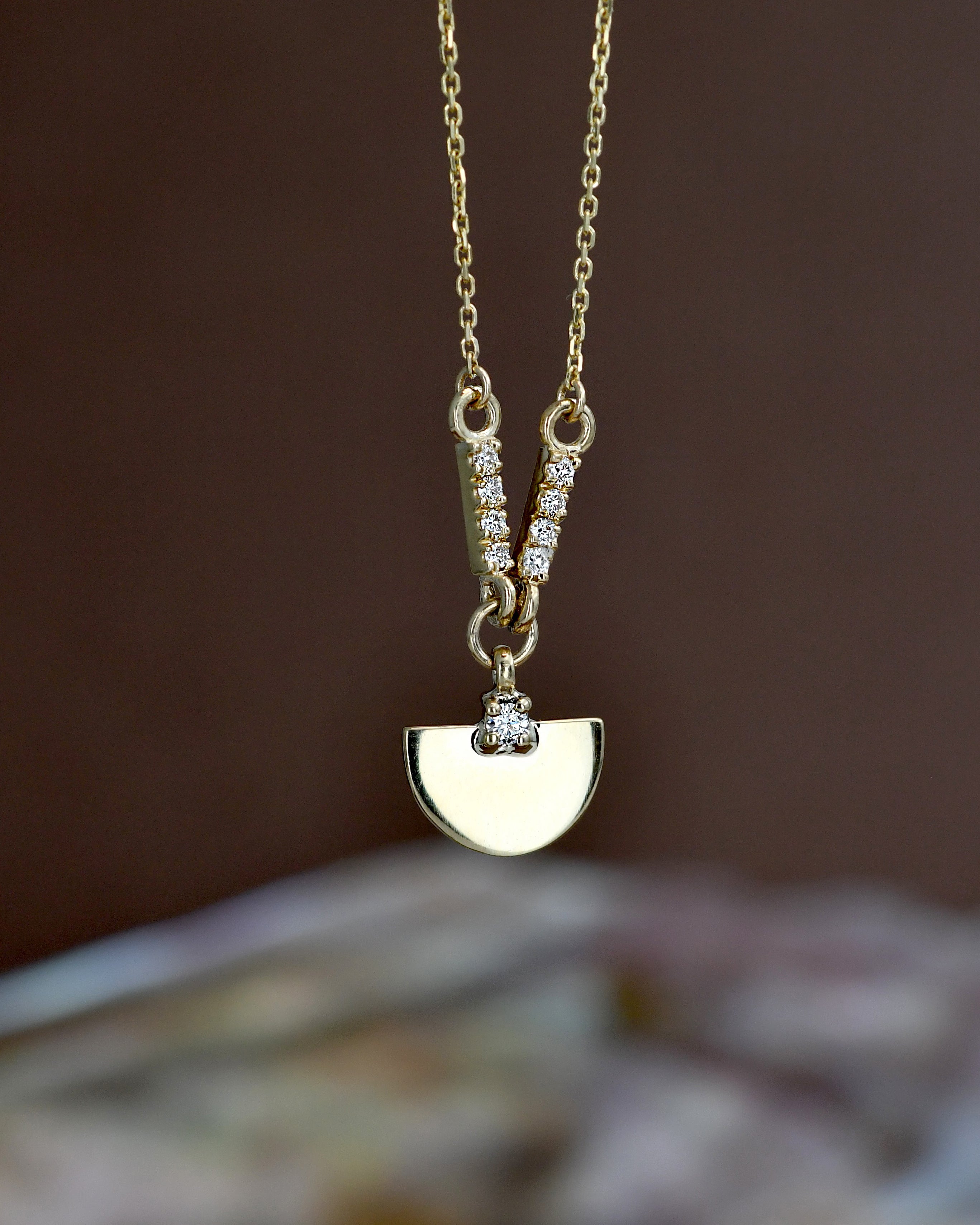 Necklace with a gold pendant, diamonds and chain 