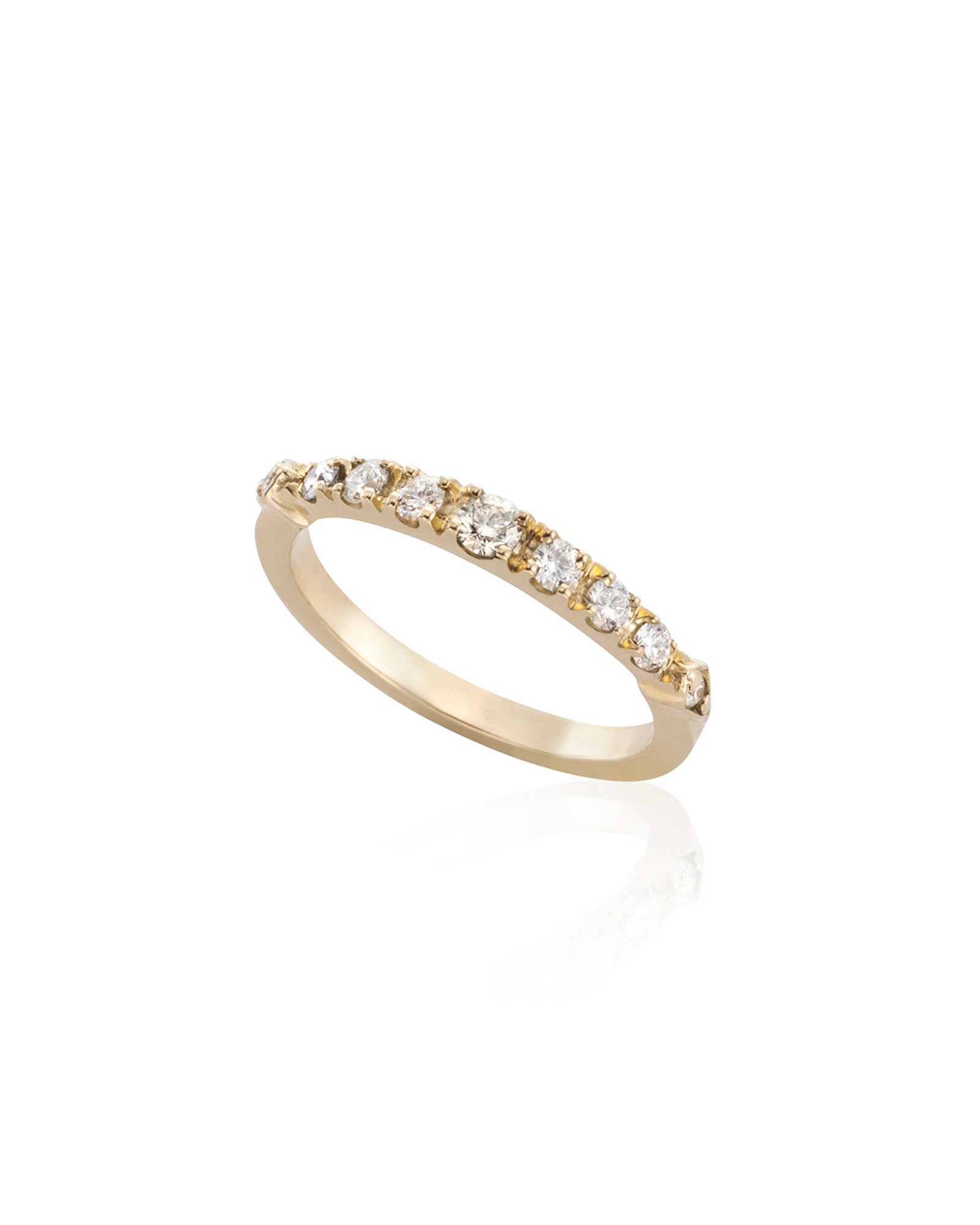 A gold band ring adorned with a series of radiant white diamonds